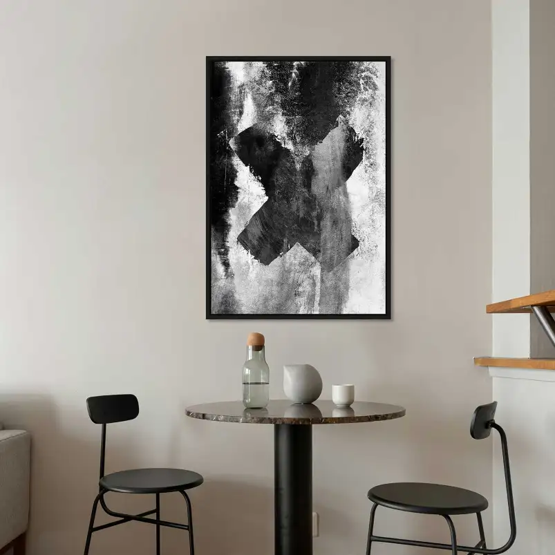 Une affiche représentant une croix noire abstraite. Une décoration minimaliste idéale pour un intérieur design.