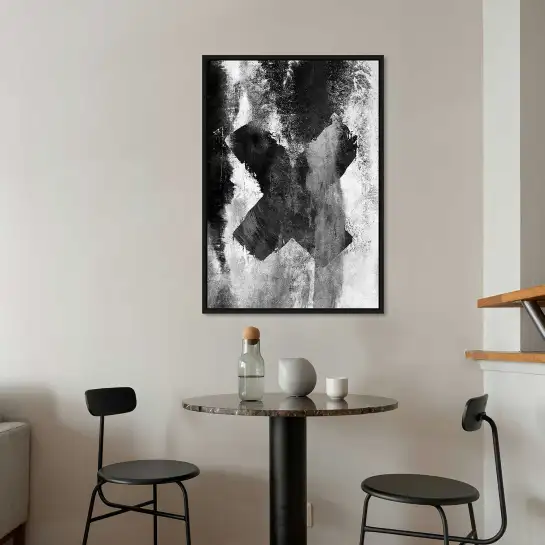 Une affiche représentant une croix noire abstraite. Une décoration minimaliste idéale pour un intérieur design.